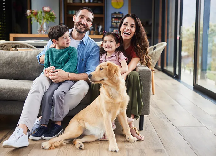 family on the couch of their home