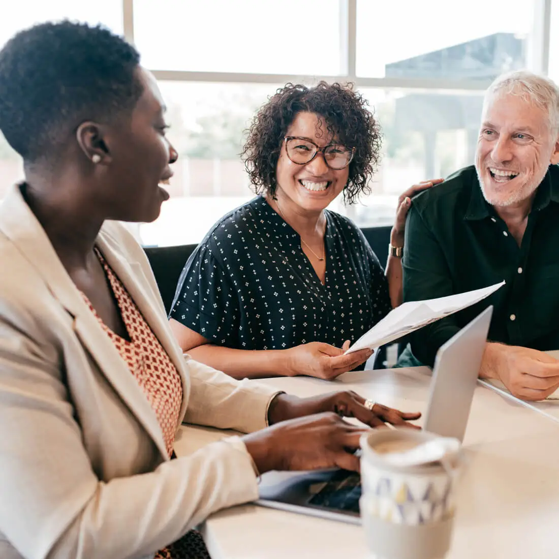 business team laughing with eachother