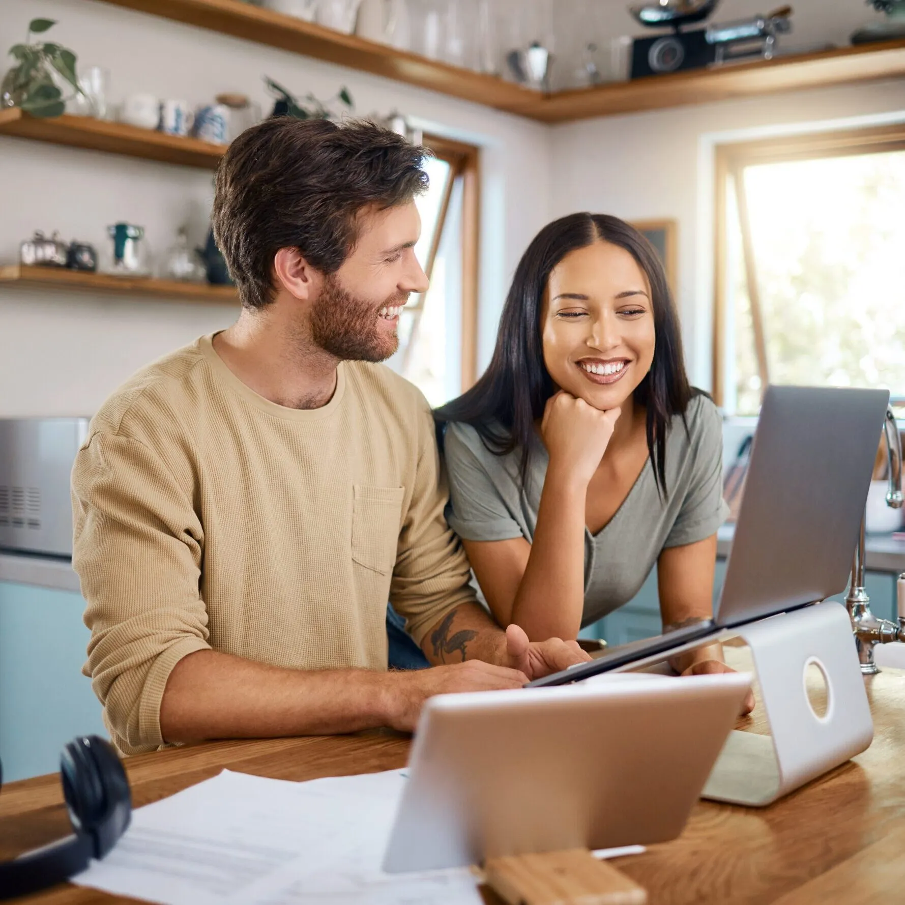couple on computer in kitchen