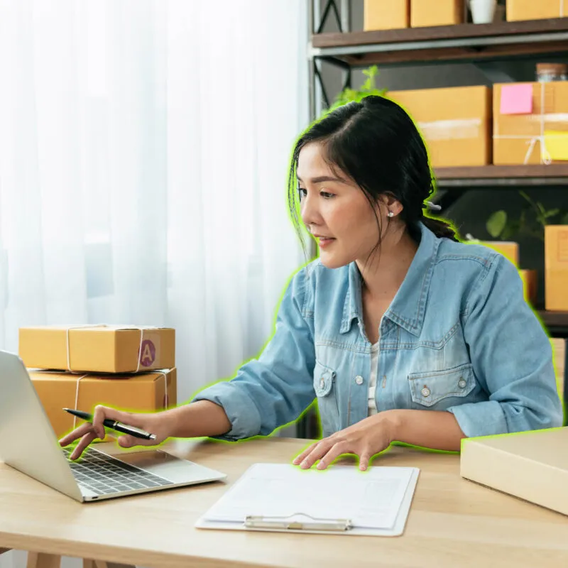 woman on laptop inputting finances