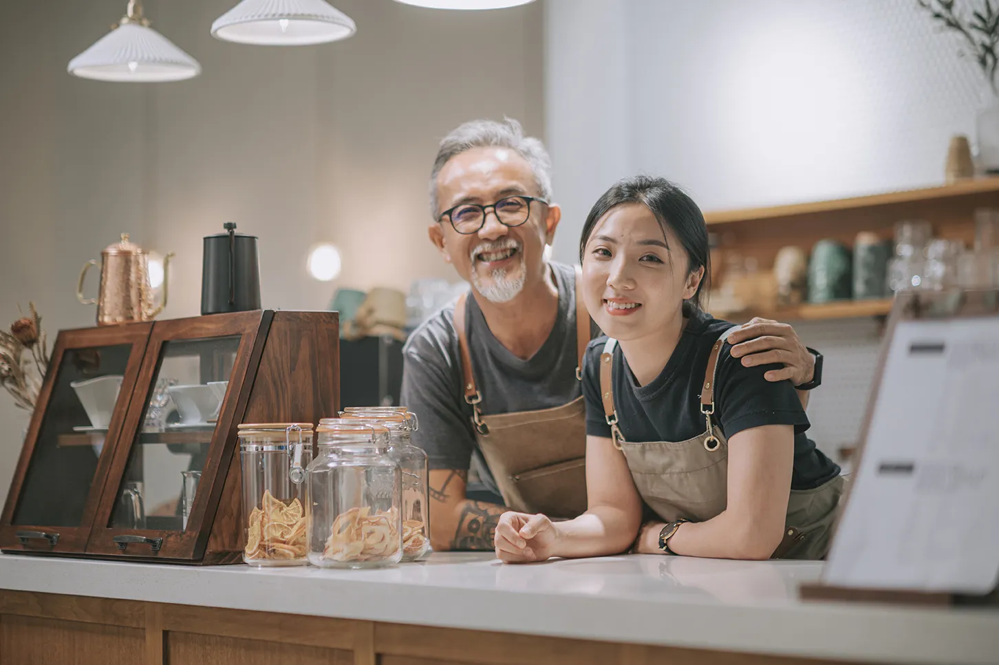 family business owners hugging