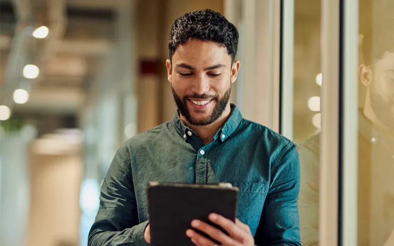 man looking at his finances on a tablet