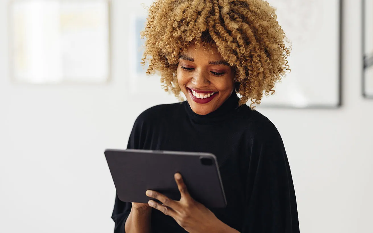 woman on tablet looking at online banking